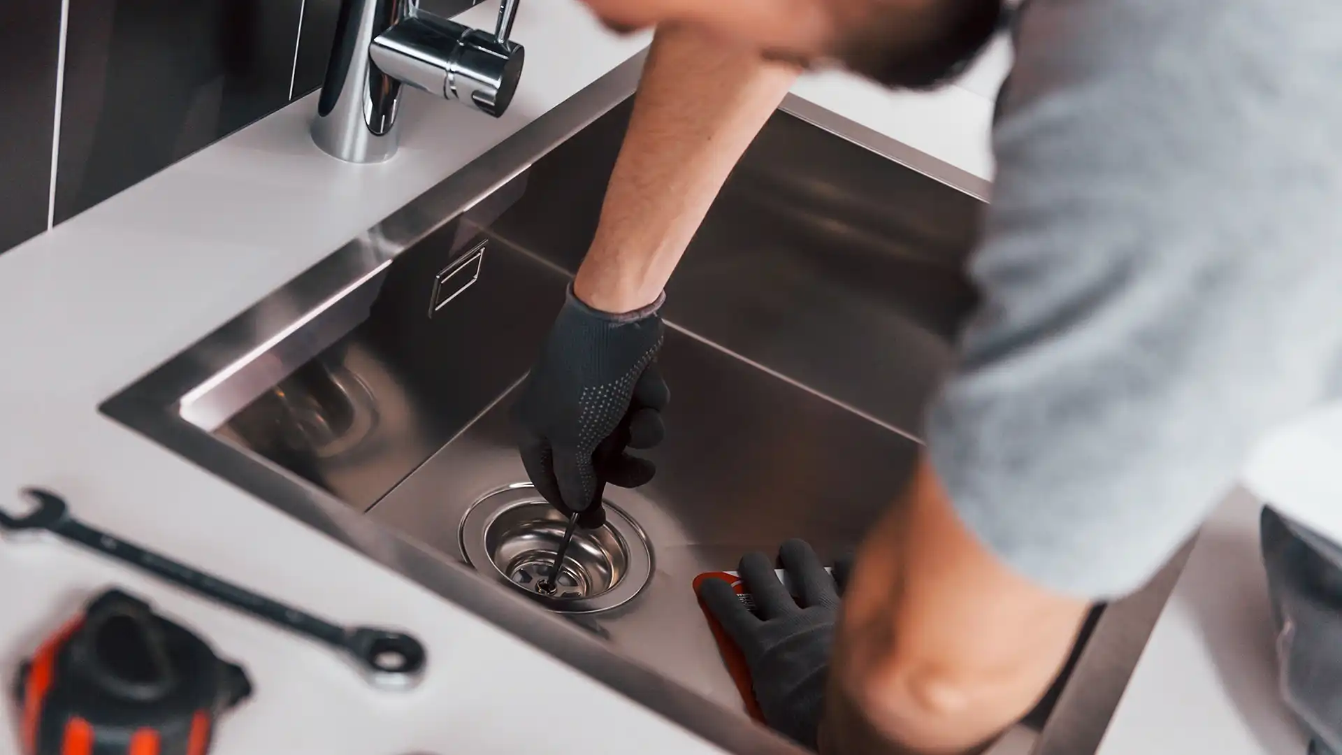 plumber fixing sink