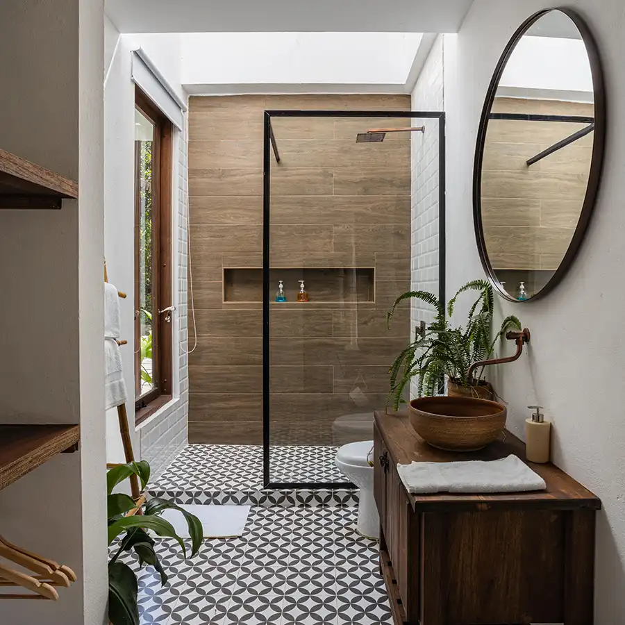modern shower room fitted with wet floor and black brasswear fittings